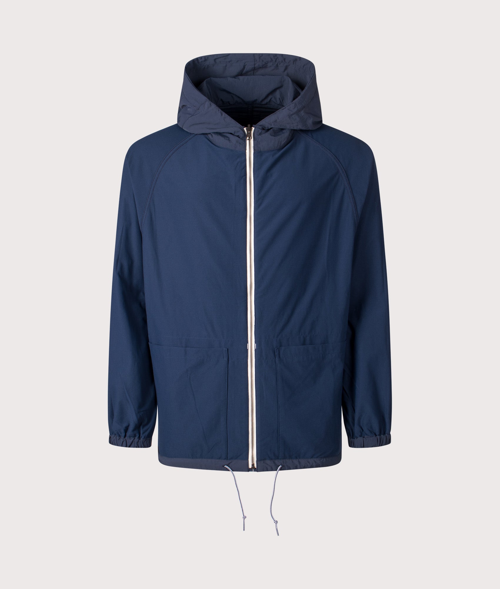 Nanamica Reversible Hooded Jacket in Navy at EQVVS Menswear. Alternate side front shot.