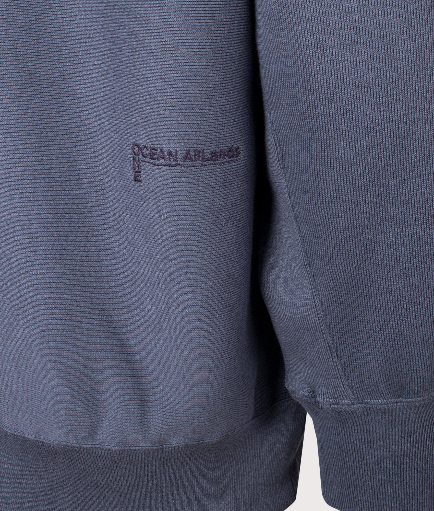 Nanamica Pullover sweat hoodie in Heather Navy at EQVVS Menswear. Secondary detail shot.
