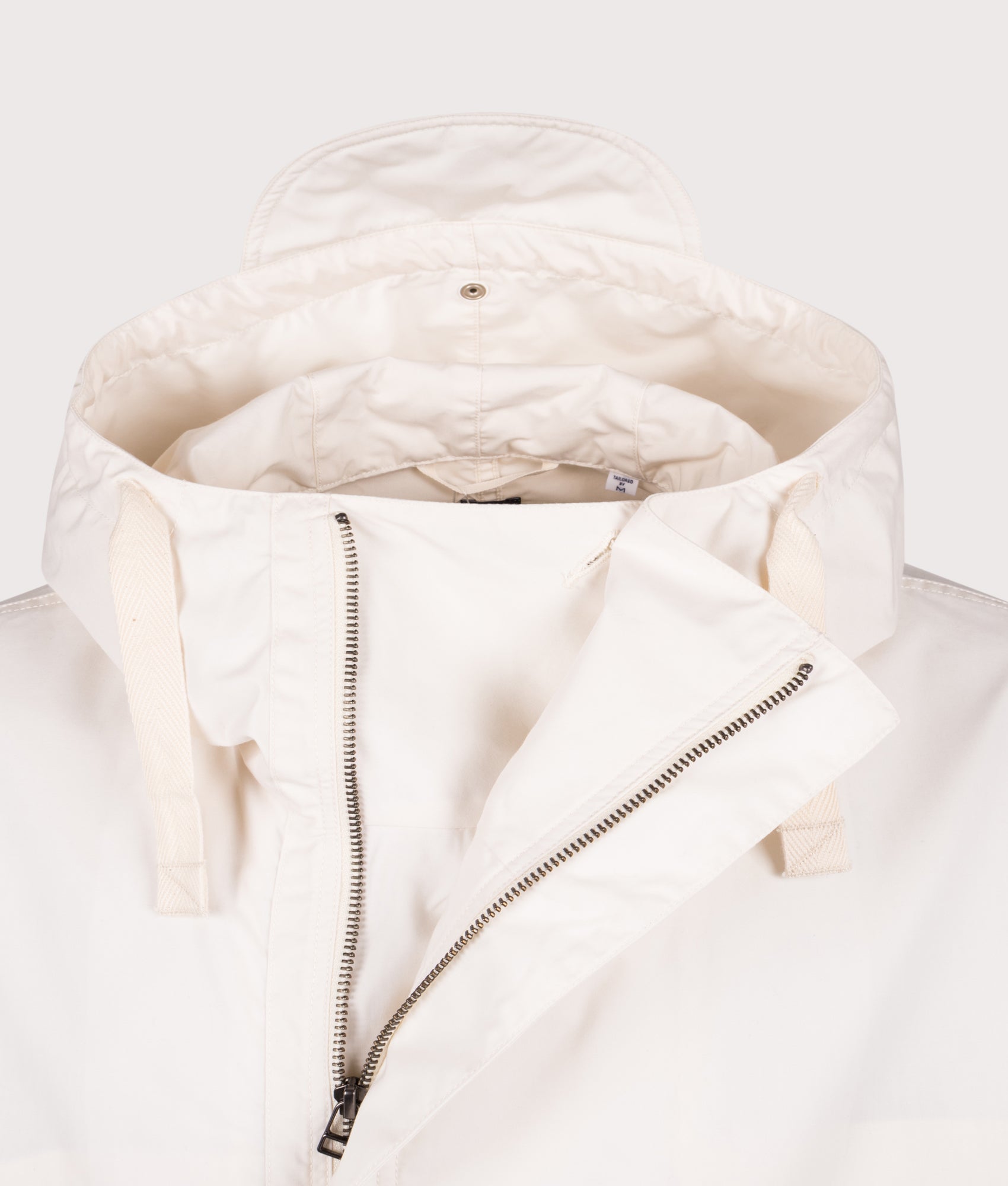 Nanamica Hooded Deck jacket in Off White at EQVVS Menswear. Detail shot.