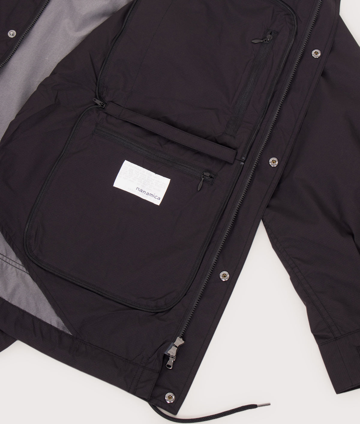 nanamica Packable Field Jacket in Black at EQVVS Menswear. Detail shot.