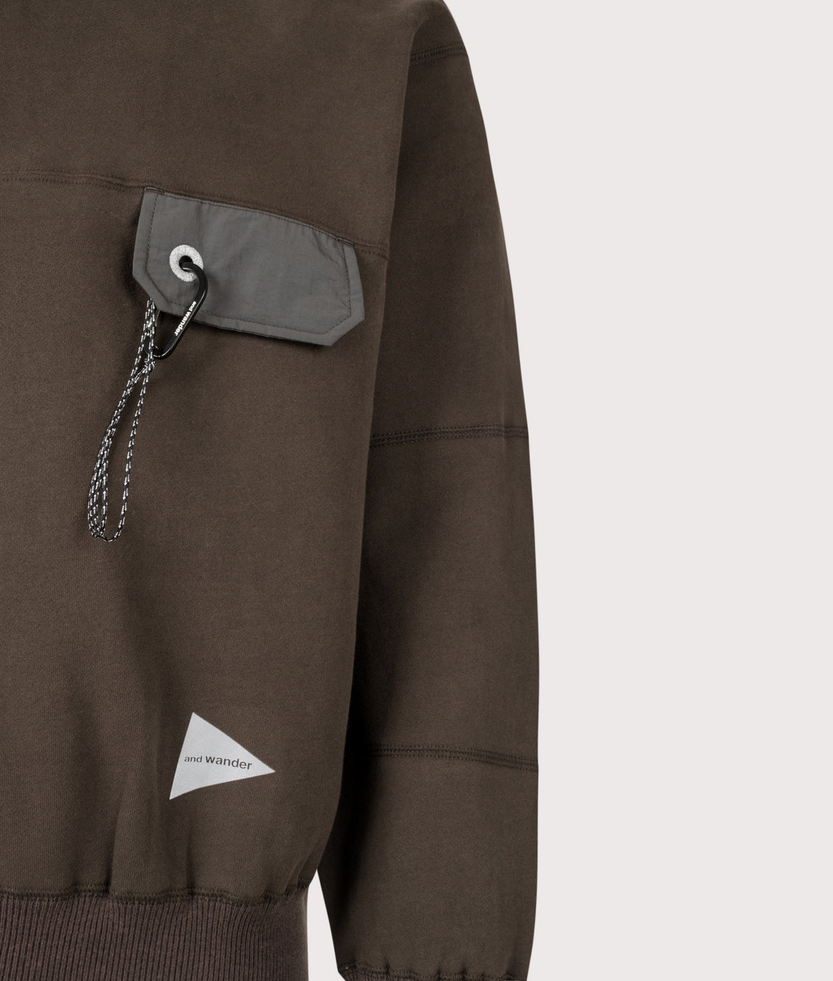 and wander Relaxed Fit Pocket Sweatshirt in Dark Brown at EQVVS Menswear. Detail shot.