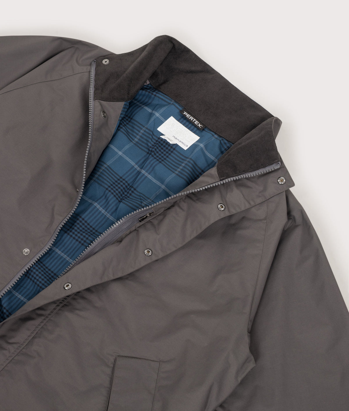 nanamica 2L PERTEX UNLIMITED Short Field Jacket in Charcoal at EQVVS Menswear. Detail shot.
