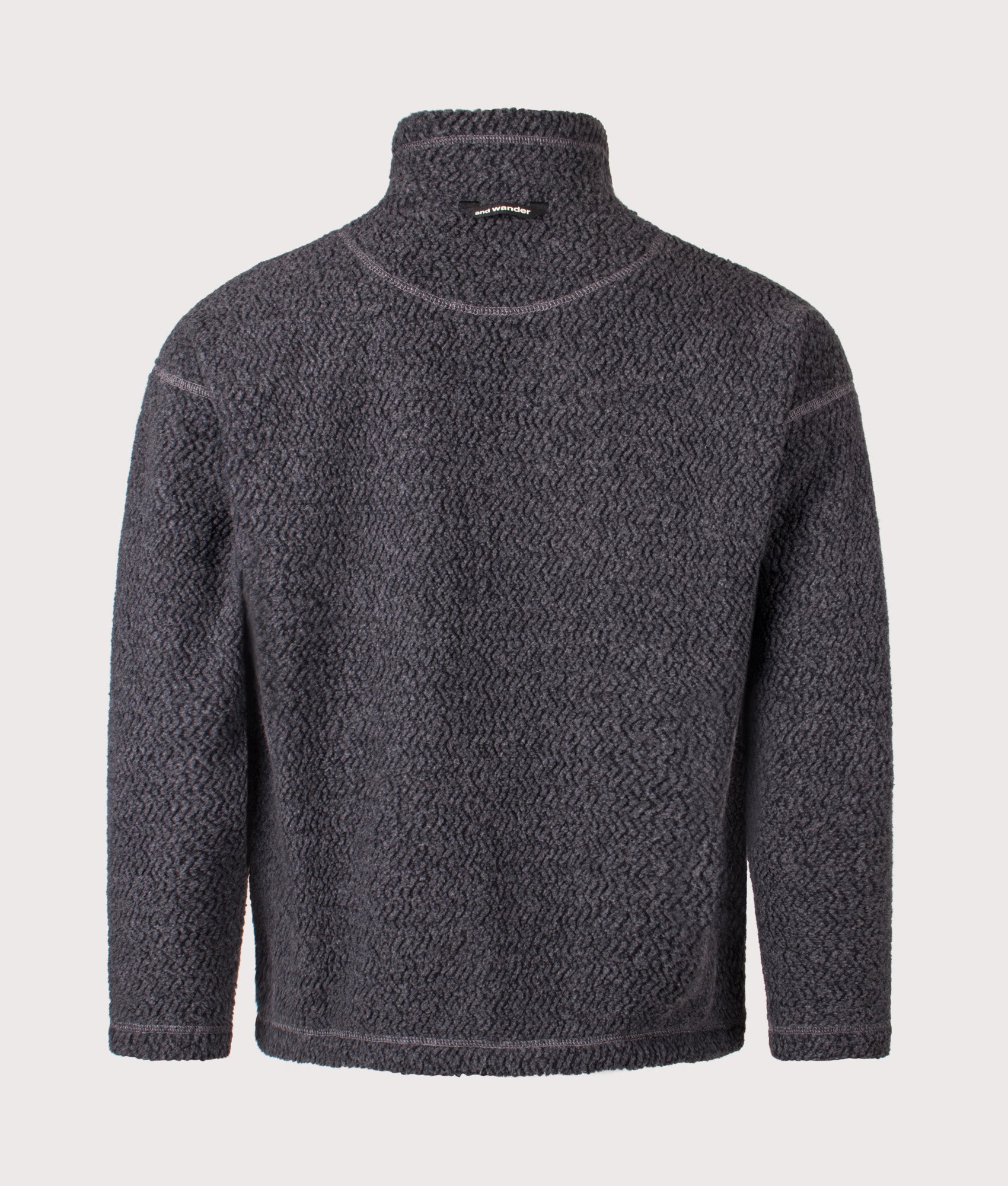 and wander Re Wool JQ Stand Zip Sweatshirt in Charcoal at EQVVS Menswear. Back shot.