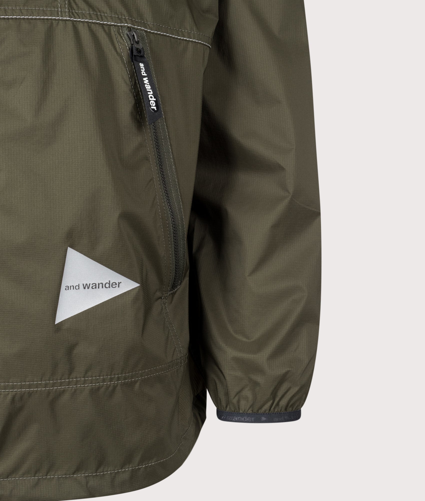 and wander Regular Fit Pertex Wind Jacket in Dark Khaki at EQVVS Menswear. Detail shot.