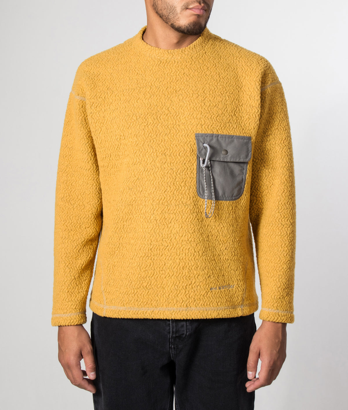and wander Relaxed fit Re wool JQ Crew Neck Jumper in Yellow at EQVVS Menswear. Model front shot.