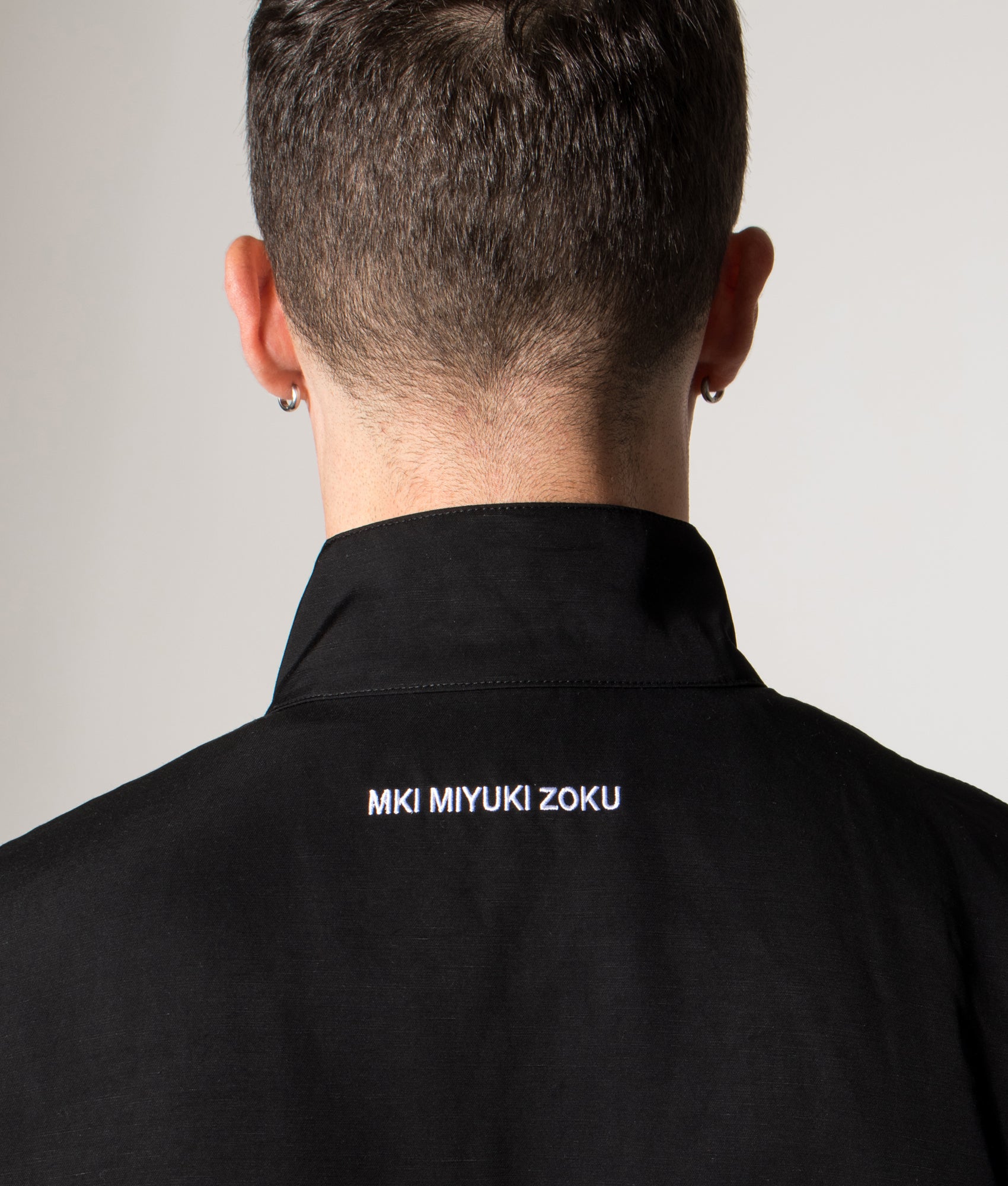 Viscose Linen Track Jacket. Shot by EQVVS. Model detailed angled shot.