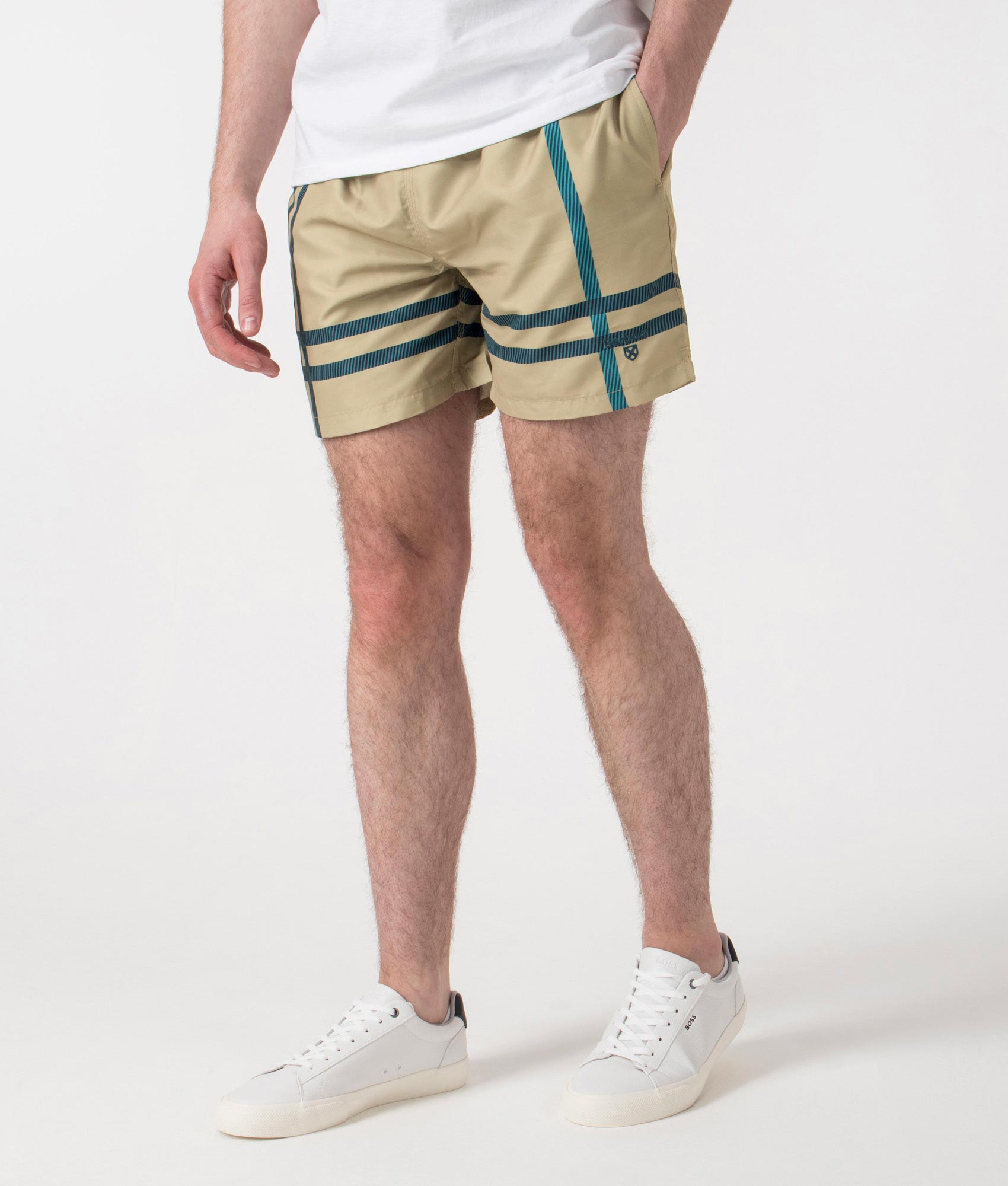 Barbour Twain Swim Shorts in Washed Stone at EQVVS. Angle Shot.