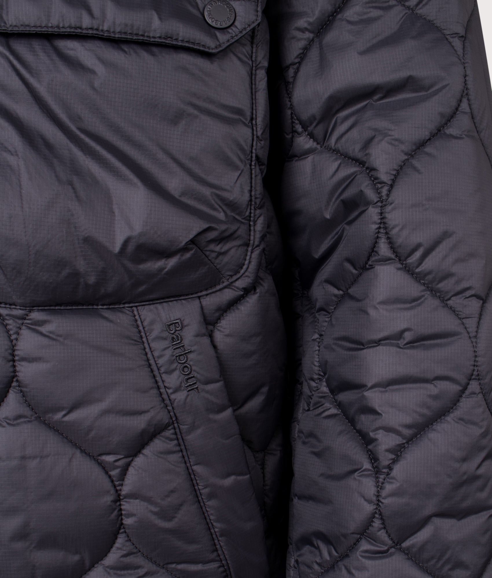 Re-Engineered Hooded Spey Quilted Jacket in Black | Barbour Lifestyle | Shot at EQVVS | Front detail shot
