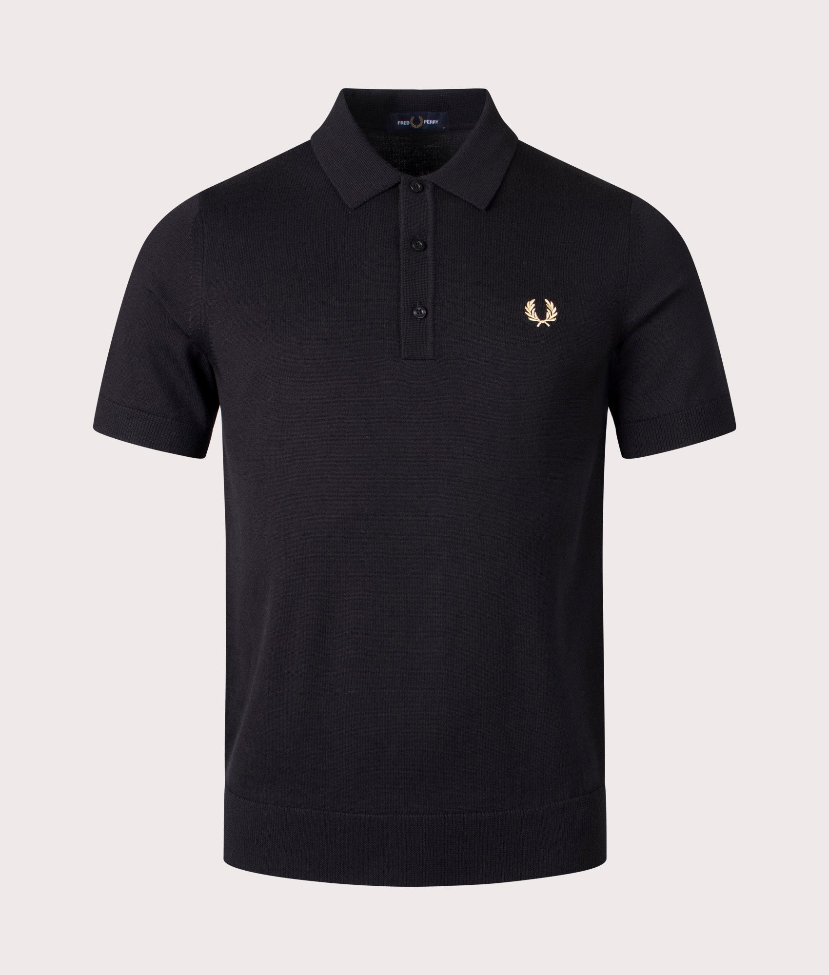 Fred Perry Classic Knitted Polo Shirt in Black, 54% Merino Wool, 46% Cotton at EQVVS. Front Shot. 