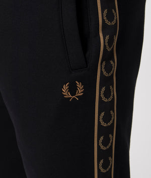 Fred Perry Taped Sweat Short in Black/Warm Stone with side taping detail.  Detail shot at EQVVS.