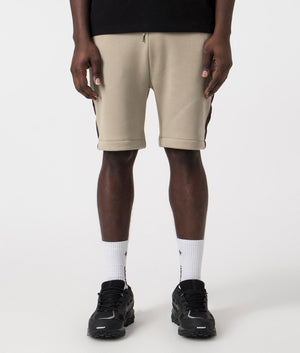 Fred Perry Taped Sweat Shorts in Warm Grey/Brick with side tape detail. Front angle shot at EQVVS.