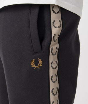 Fred Perry Taped Sweat Short in Anchor Grey/Black with side taping detail. Detail shot at EQVVS.