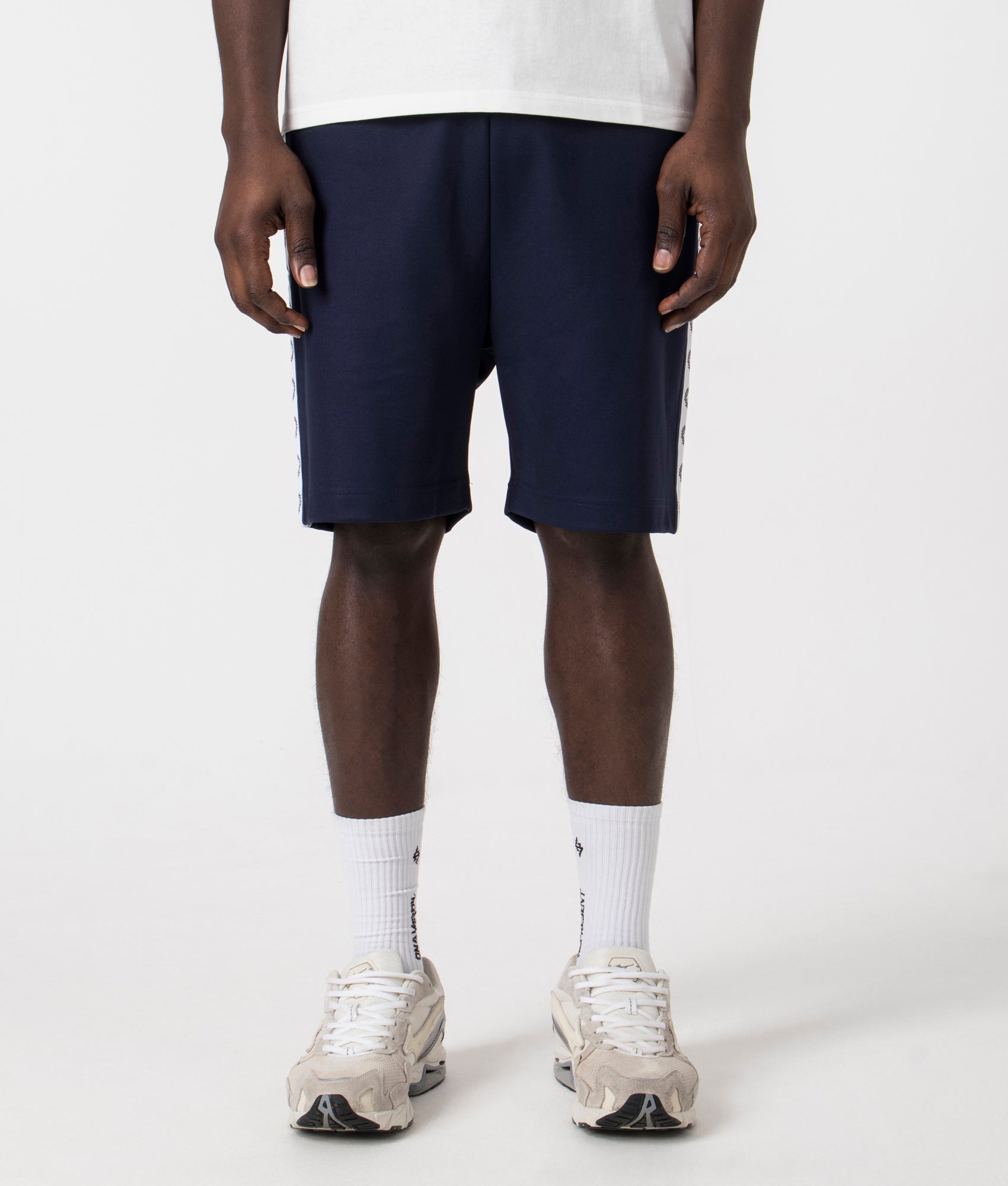 Fred Perry Taped Sweat Short in Carbon Blue with side taping detail. Front angle shot at EQVVS.