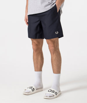 Fred Perry Classic Swim Shorts in Navy Angle Shot at EQVVS