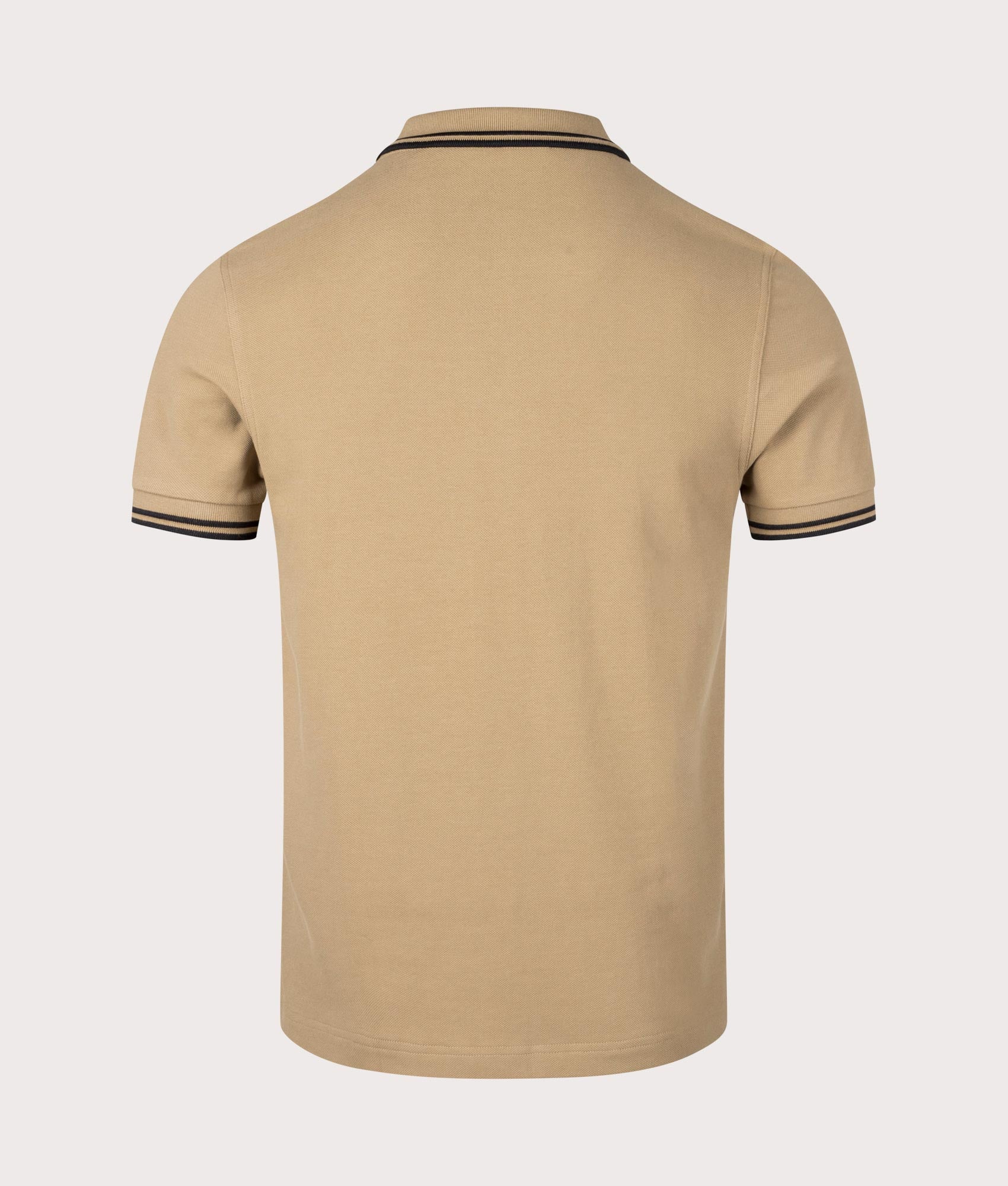 Twin Tipped Fred Perry Polo Shirt in Warm Stone. EQVVS Back Angle Shot.