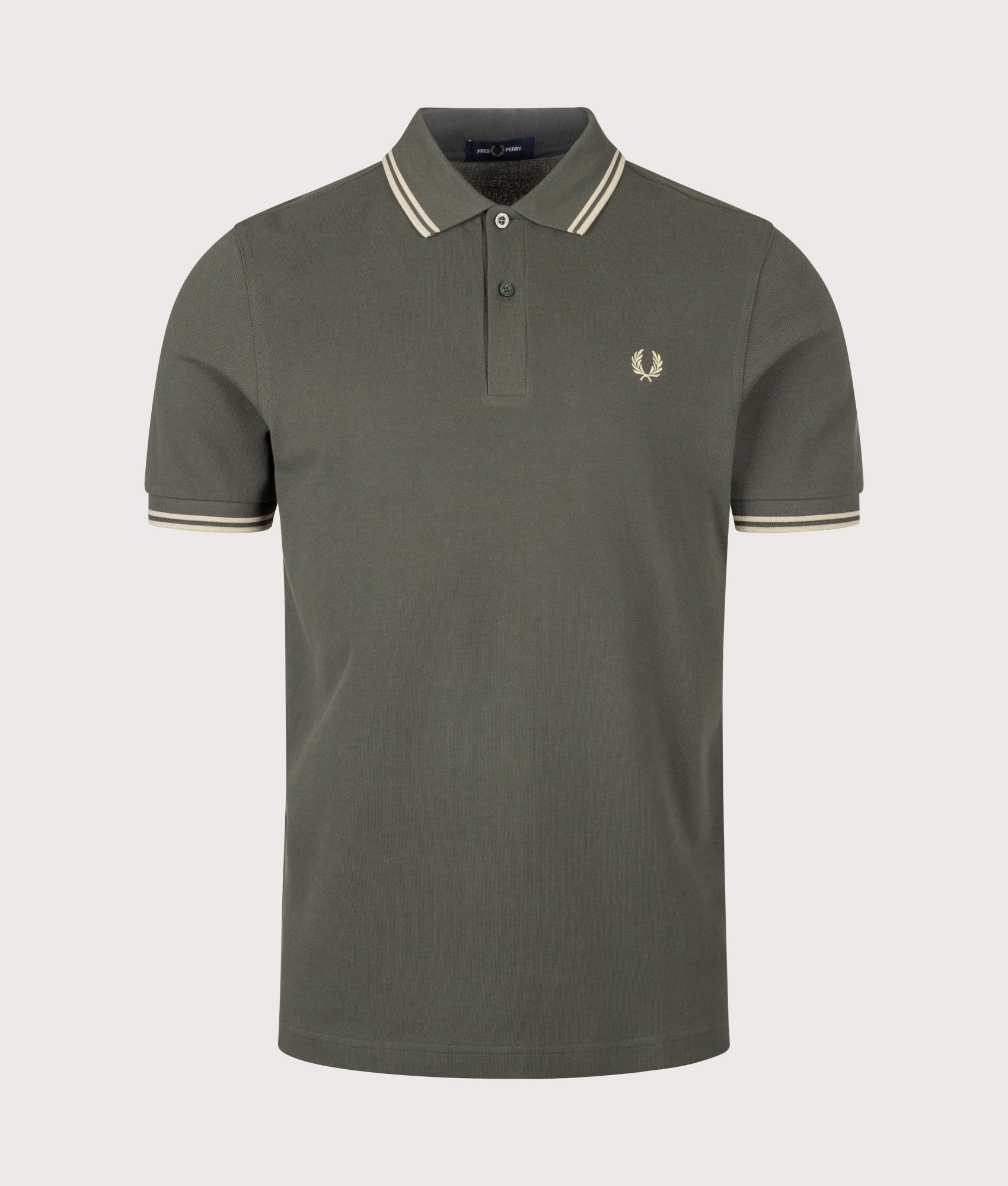 Fred Perry Twin Tipped Polo Shirt in Field Green and Oatmeal at EQVVS Menswear. Front shot.