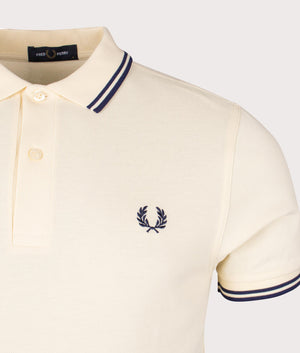 Twin Tipped Fred Perry Polo Shirt in Ice Cream and French Navy. EQVVS Detail Shot.