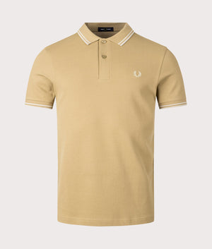 Twin Tipped Fred Perry Polo Shirt in Warm Stone by Fred Perry. EQVVS Front Angle Shot.