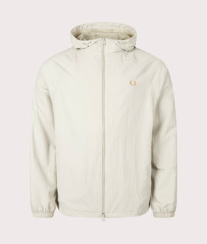 Hooded Shell Jacket in Light Oyster by Fred Perry. EQVVS Front Angle Shot.