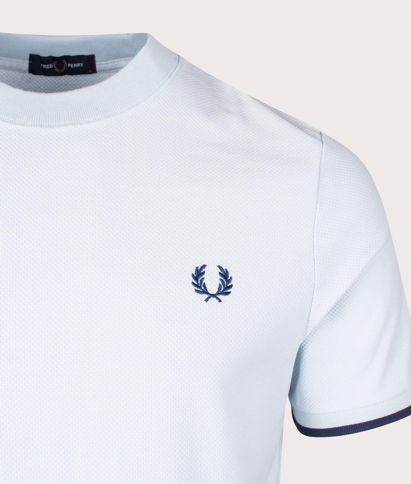 Tipped Cuff Pique T-Shirt in Light Ice by Fred Perry. EQVVS Detail Angle Shot.