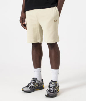 Peached Sweat Shorts in Light Oyster by Fred Perry. EQVVS Model Shot. 
