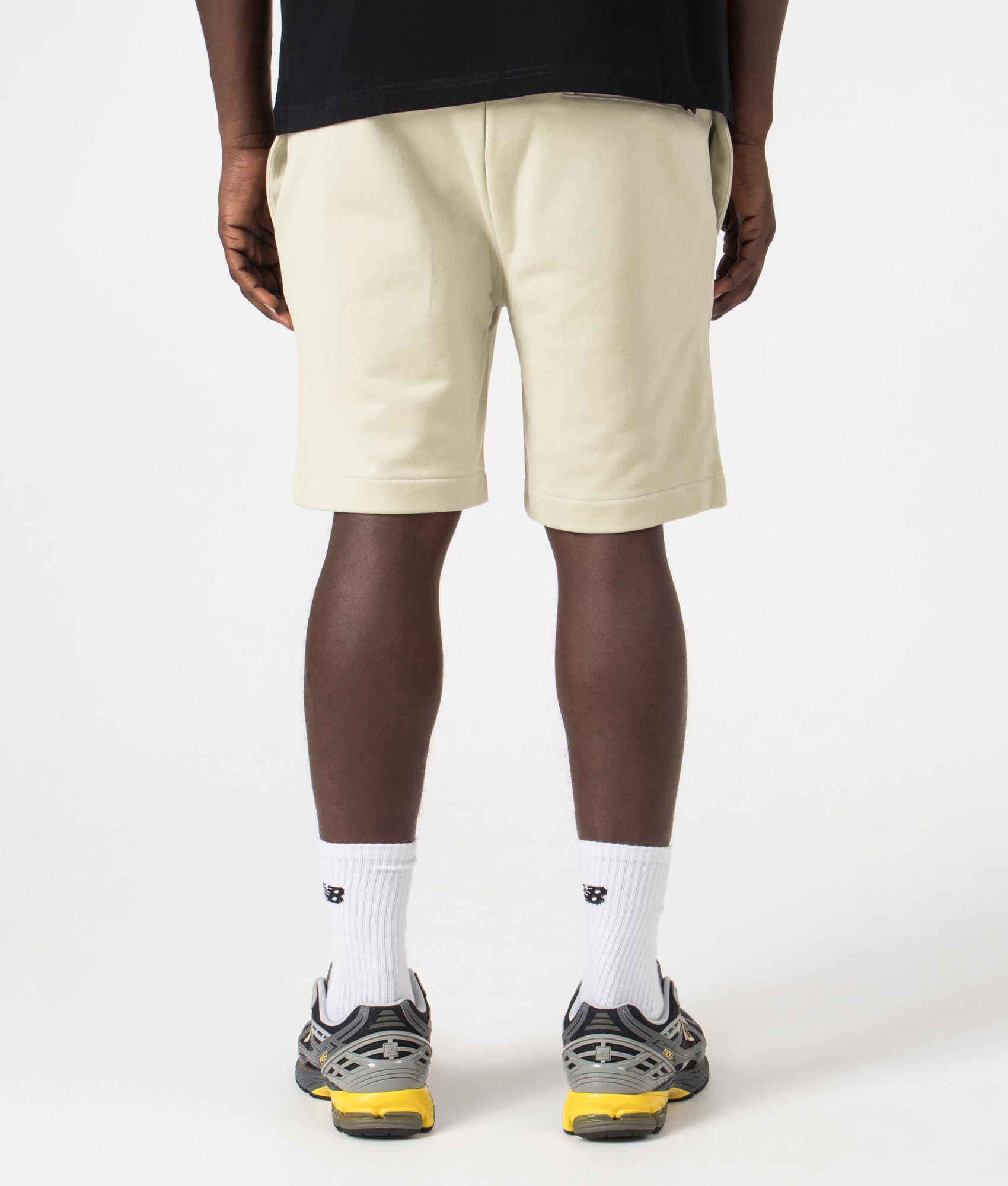 Peached Sweat Shorts in Light Oyster by Fred Perry. EQVVS Model Shot.