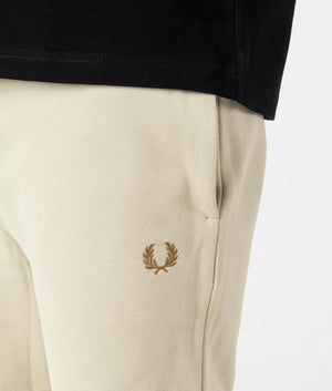 Peached Sweat Shorts in Light Oyster by Fred Perry. EQVVS Model Shot.