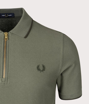 Crepe Pique Zip Neck Polo Shirt in Laurel Wreath Green by Fred Perry. EQVVS Shot.