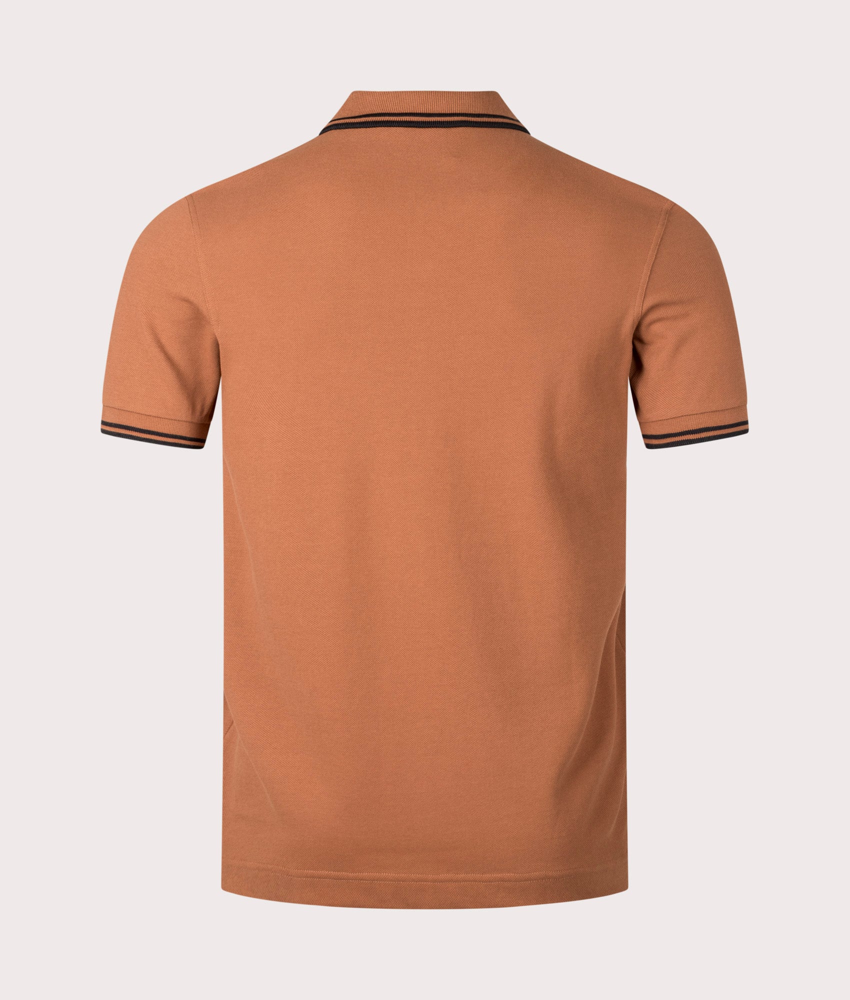 Fred Perry Twin Tipped Polo Shirt in Marmalade. Shot at EQVVS. Reverse shot. 