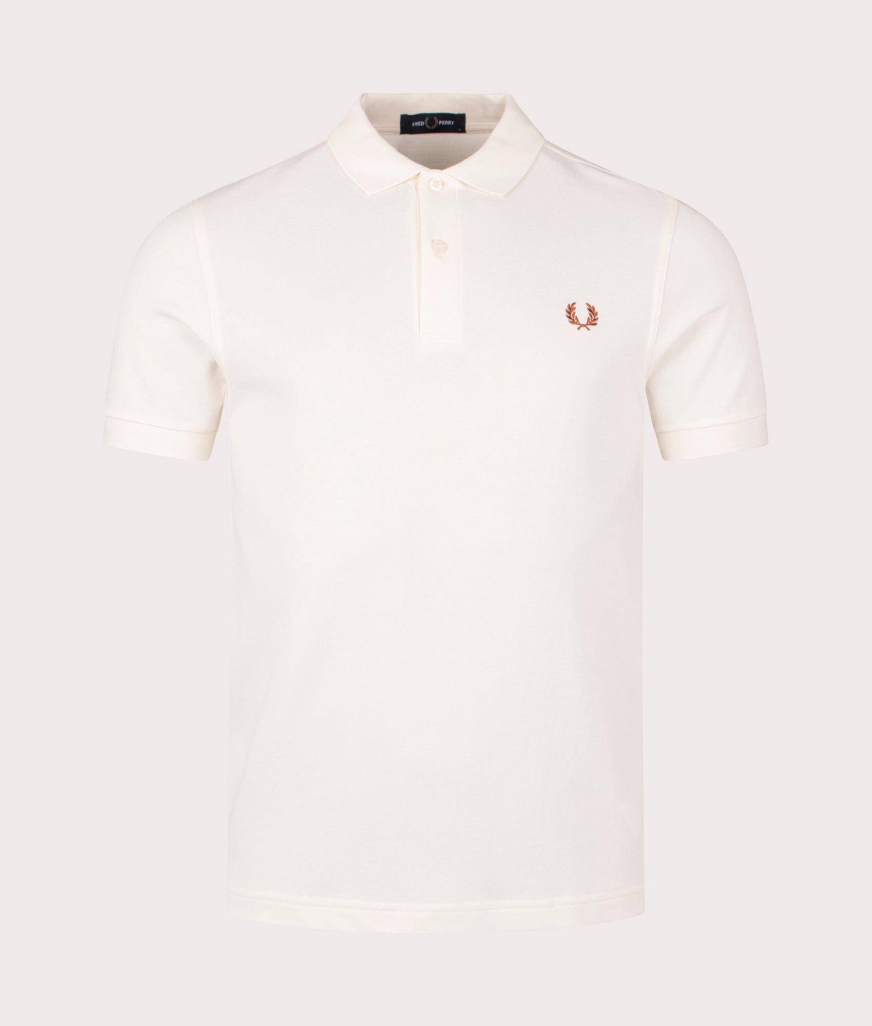 The Fred Perry Polo Shirt in Ecru. Shot at EQVVS. Front shot. 