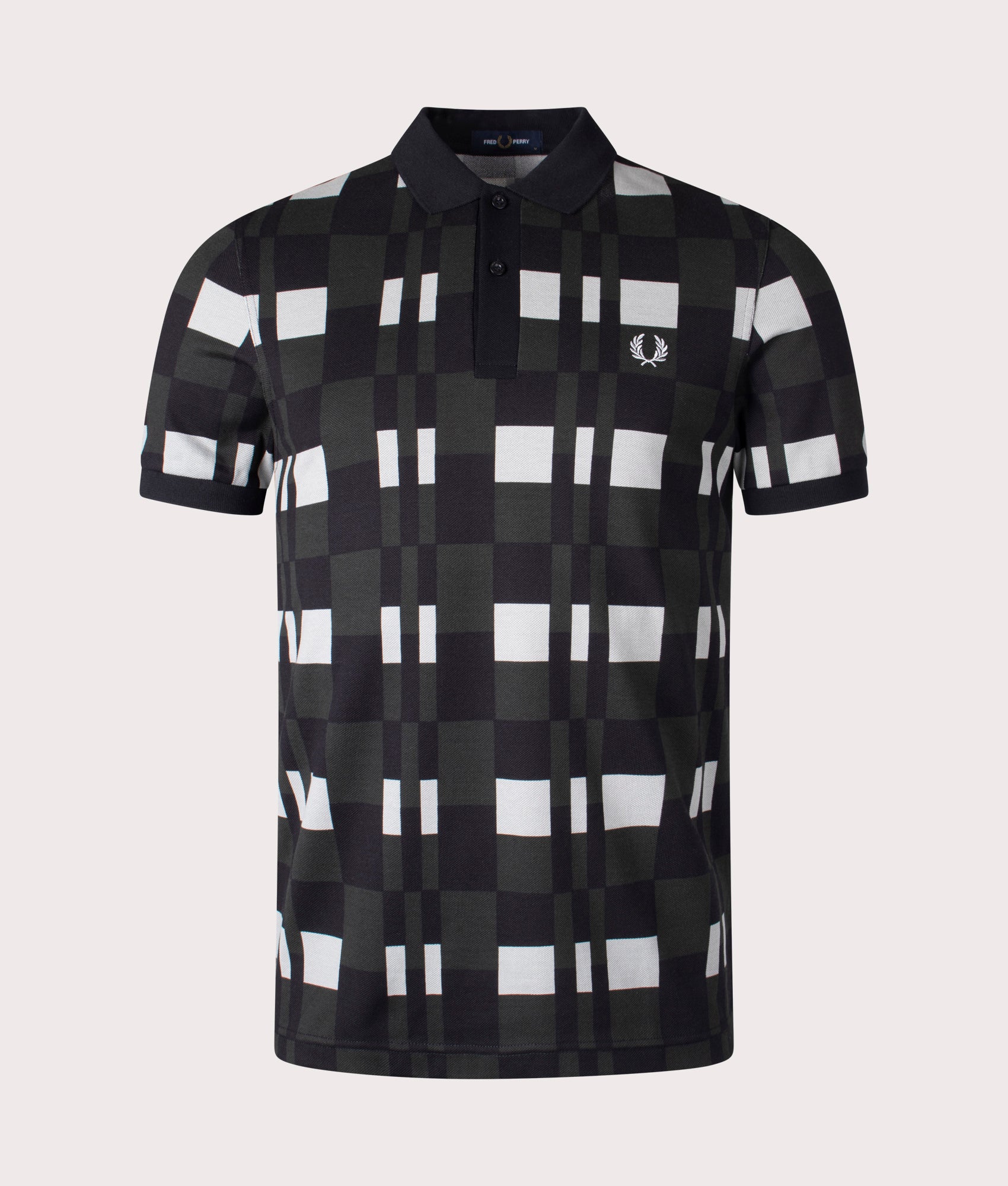 The Fred Perry Split Chequerboard Print Polo Shirt in Limestone. Front angle shot at EQVVS.