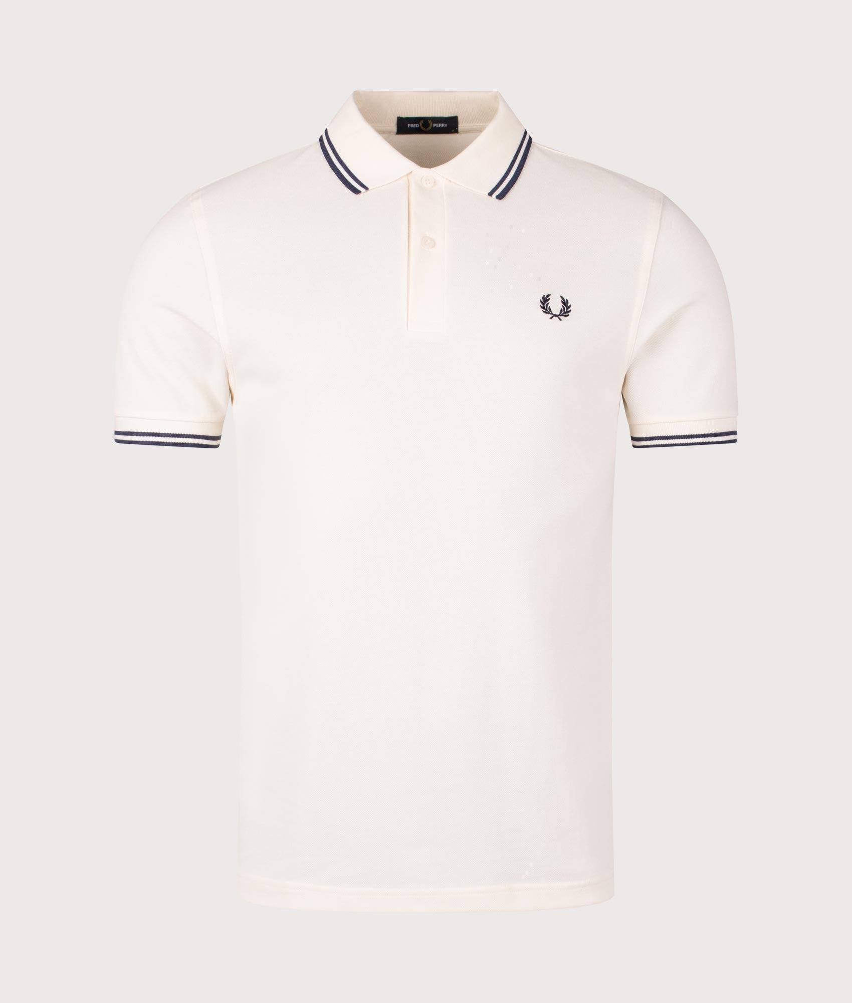 Fred Perry Twin Tipped Polo Shirt in Ecru/Tennis Blue, 100% Cotton at EQVVS. Front shot.