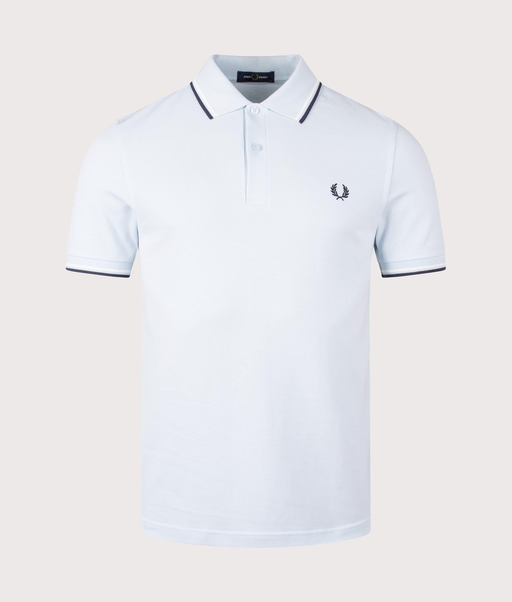 Fred Perry Twin Tipped Polo Shirt in Light Ice/Snow White/Tennis Blue. Shot at EQVVS.  Front shot. 