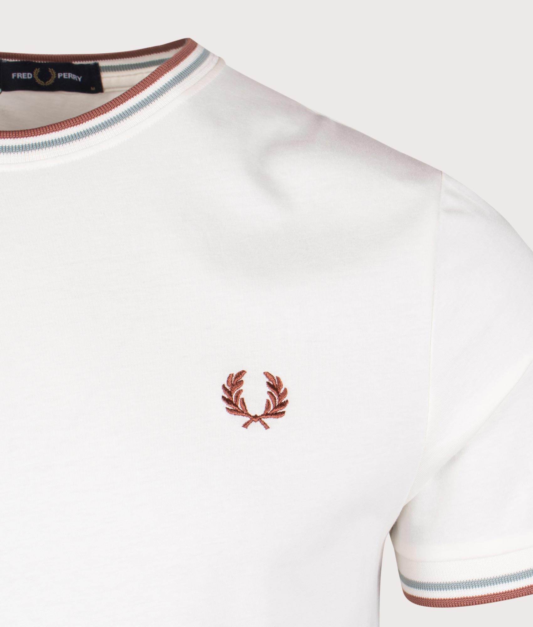 Fred Perry Twin Tipped T-Shirt in Light Ecru. Shot at EQVVS. Detail shot. 