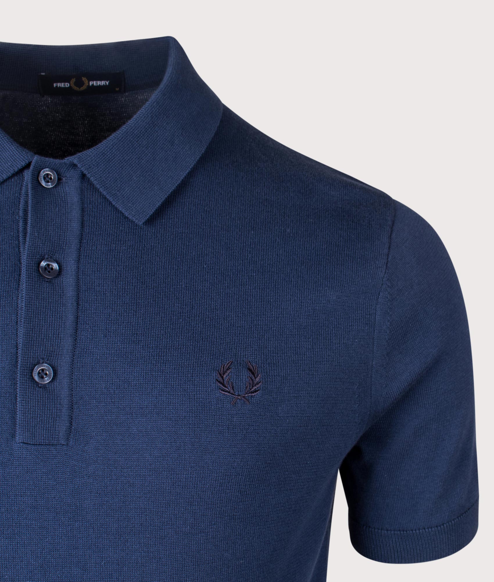 Fred Perry Cotton Polo Shirt in Tennis Blue. Shot at EQVVS.  Detail shot. 