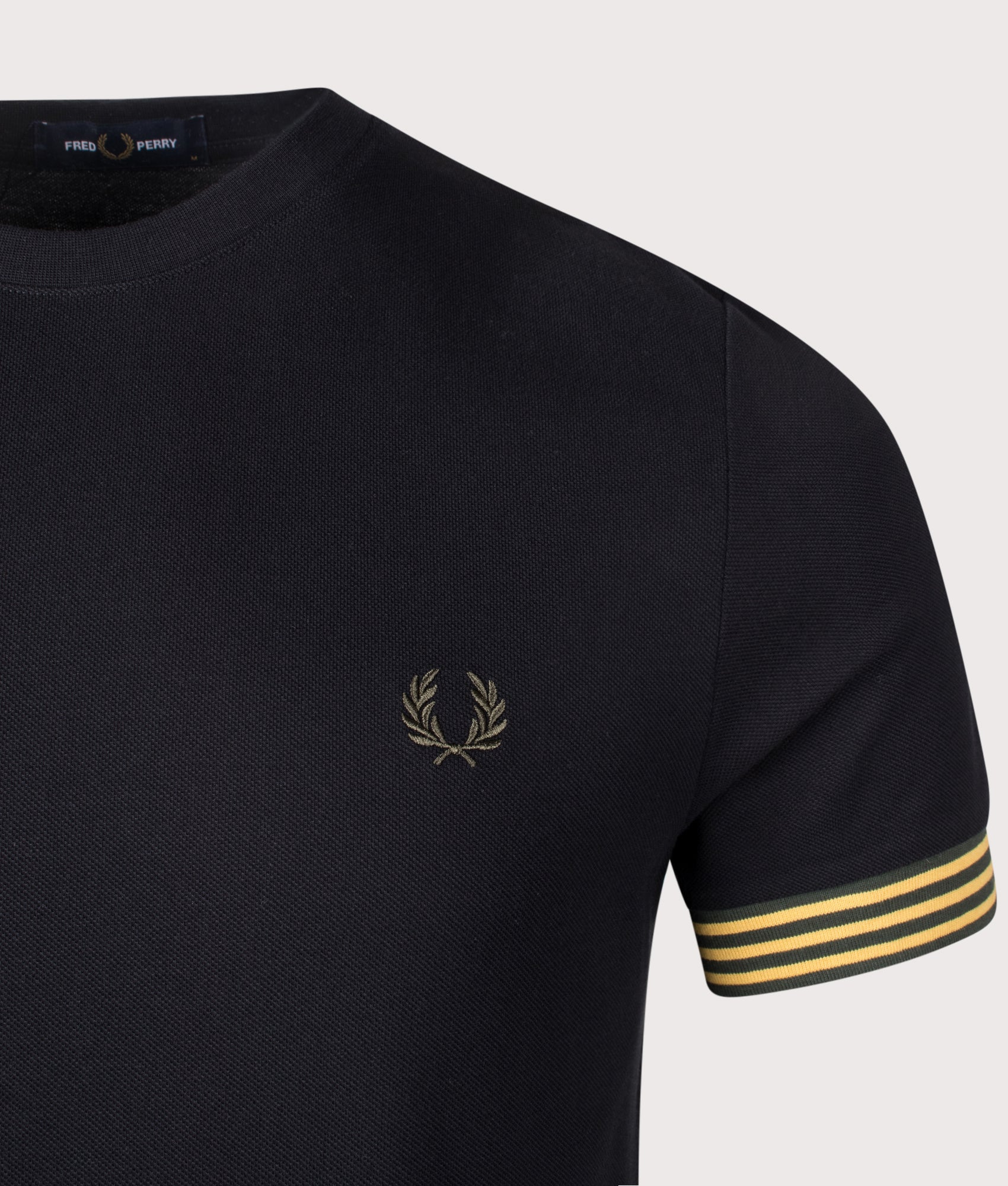 Black Striped Cuff T-Shirt by Fred Perry. Shot at EQVVS. Detail shot. 