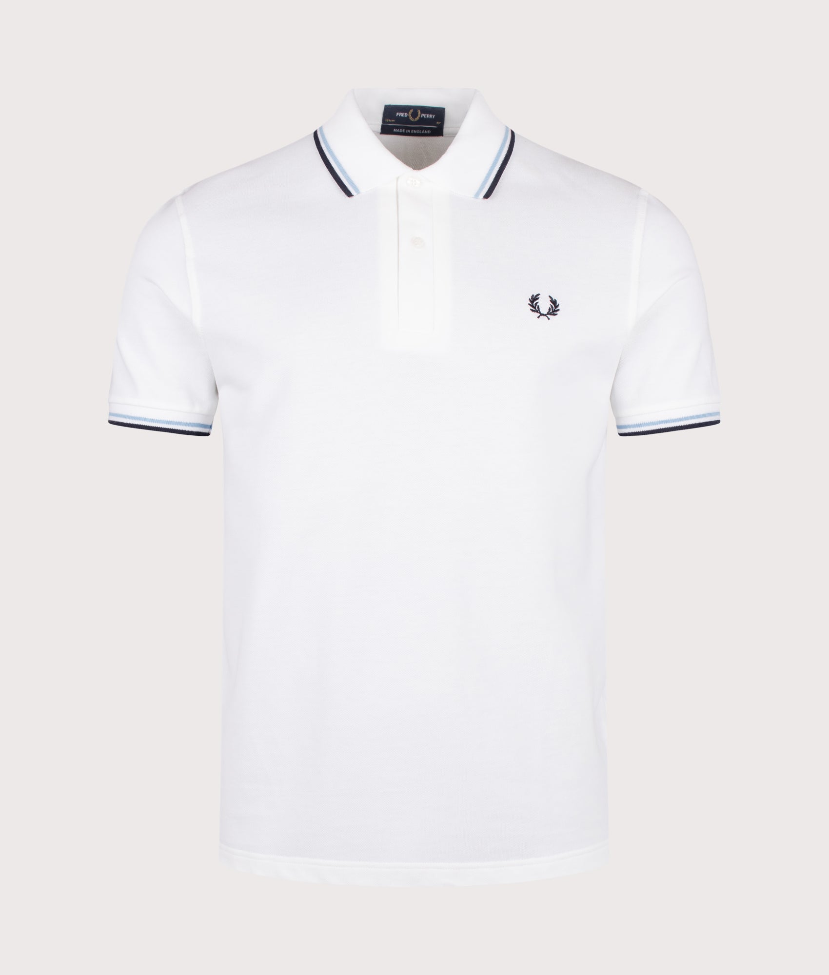 Fred Perry M12 Twin Tipped Fred Perry Polo Shirt in White, Ice and Navy at EQVVS Menswear. Front shot.