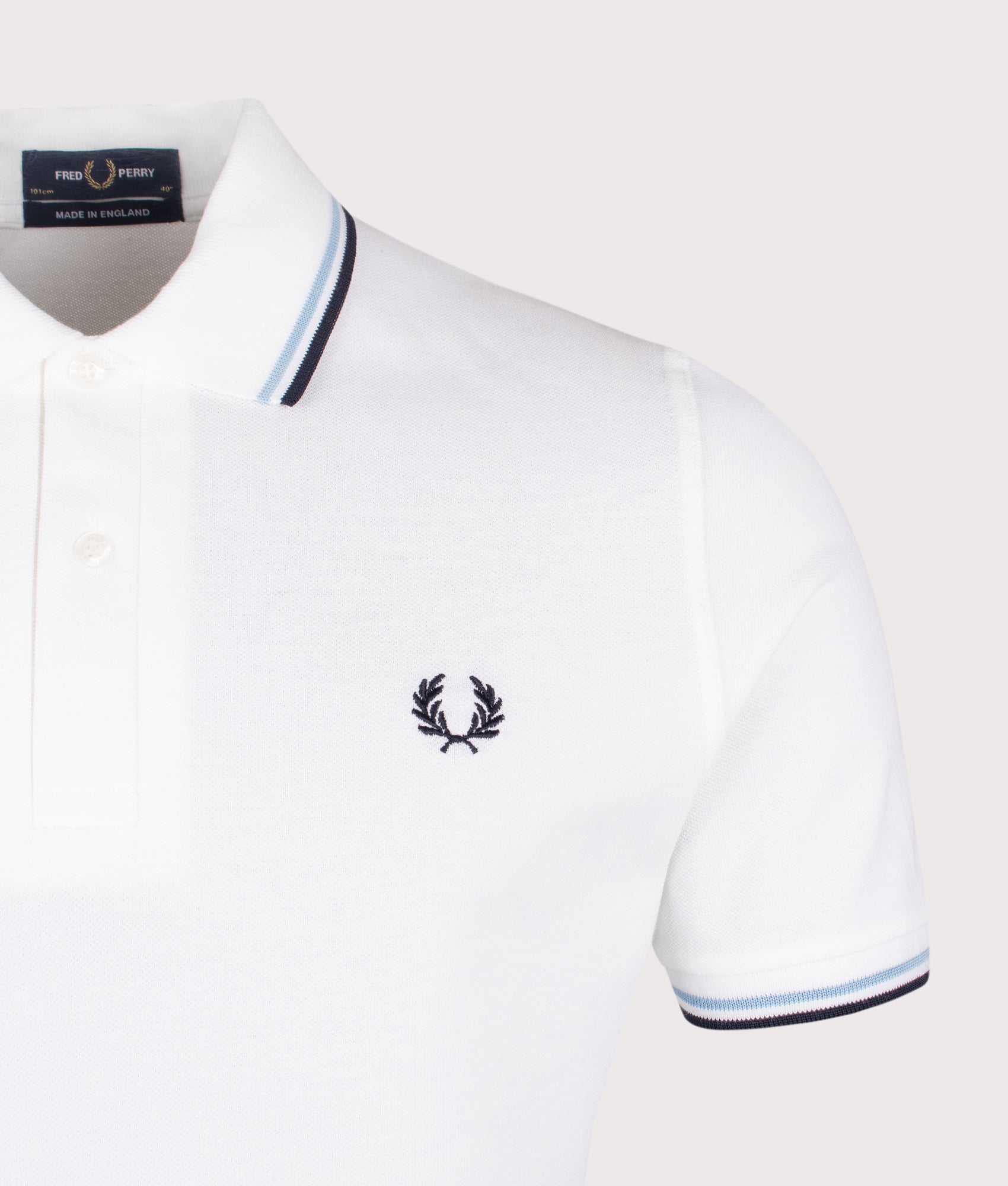 Fred Perry M12 Twin Tipped Fred Perry Polo Shirt in White, Ice and Navy at EQVVS Menswear. Detail shot.
