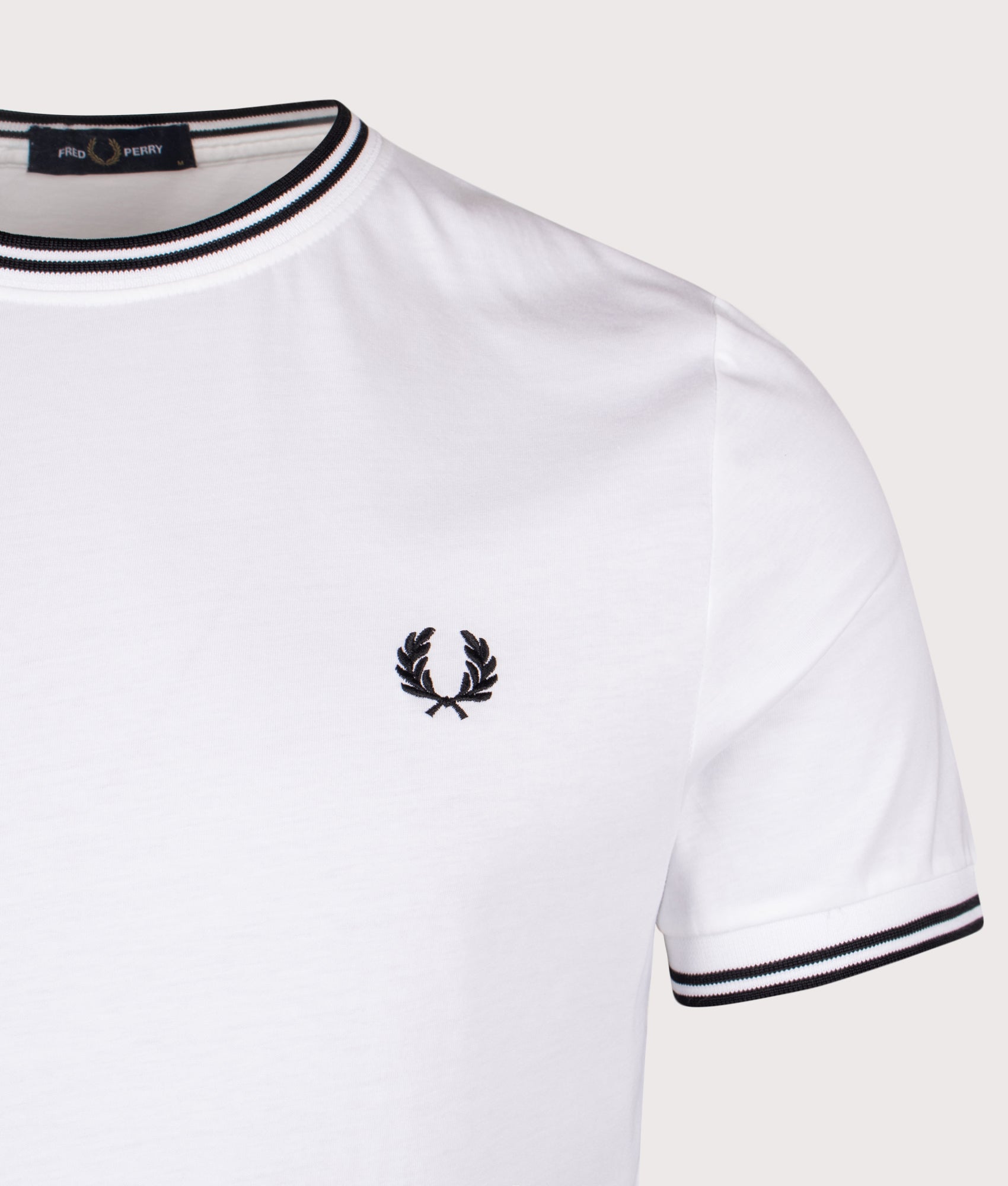 Fred Perry Twin Tipped T-Shirt in White at EQVVS Menswear. Detail shot.