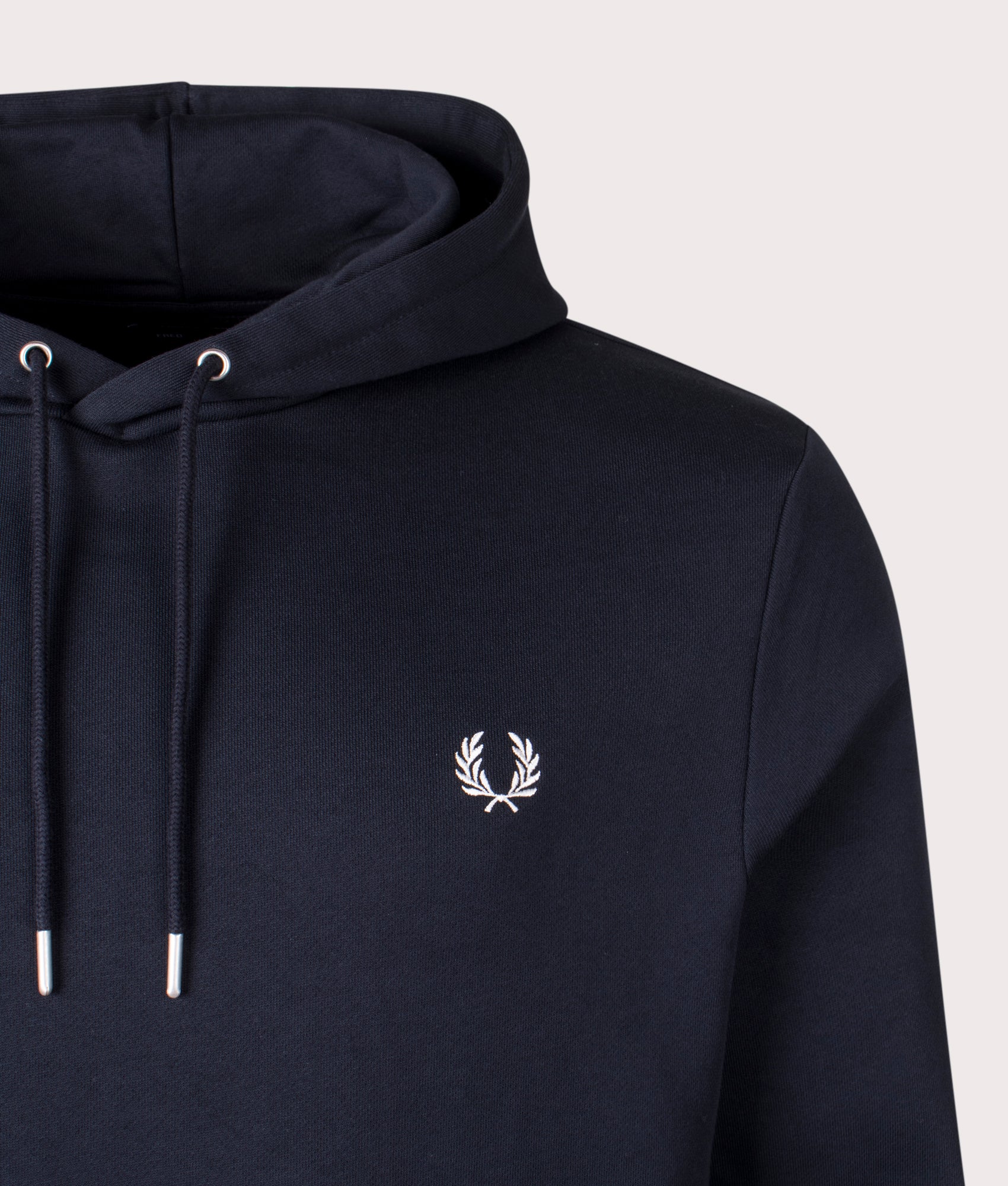 Fred Perry Twin Tipped Hoodie in Navy at EQVVS Menswear. Detail shot.
