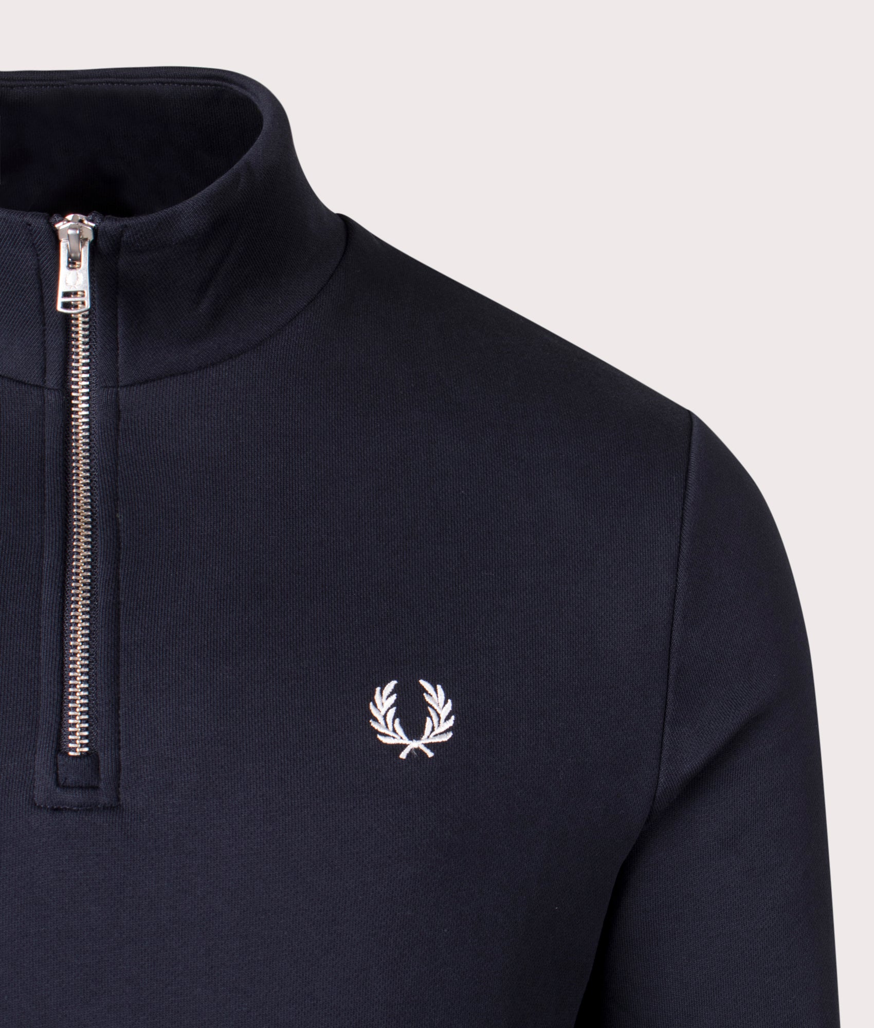 Fred Perry Quarter Zip Sweatshirt in Navy at EQVVS Menswear. Detail shot.