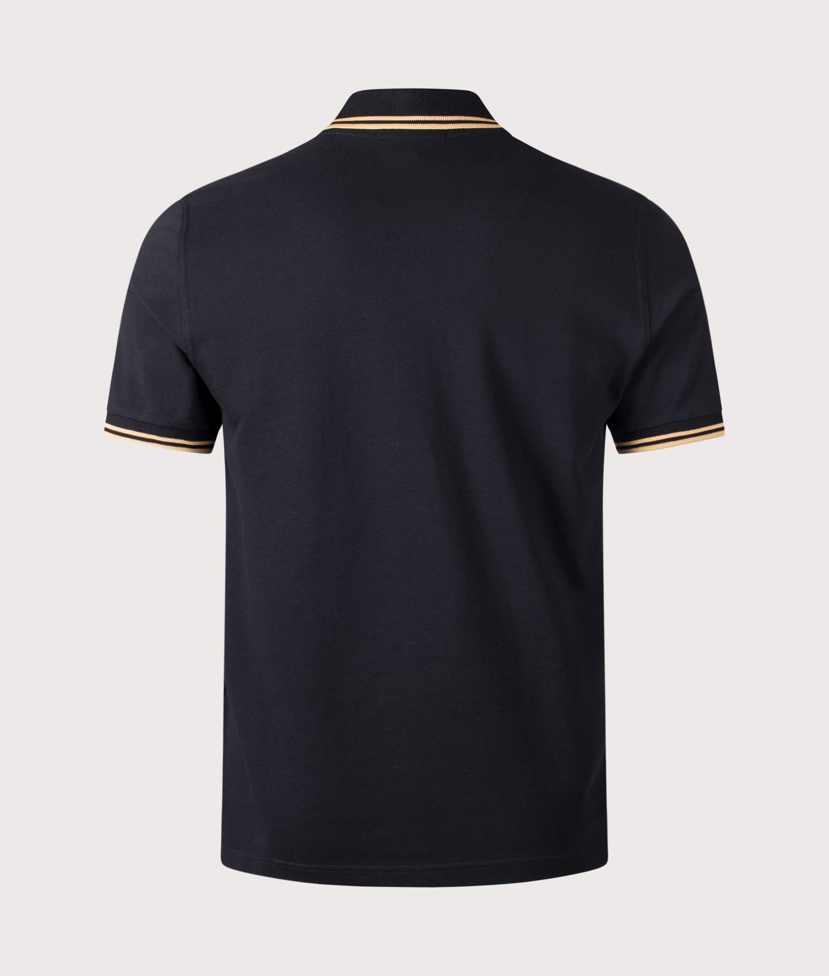Fred Perry M12 Twin Tipped Fred Perry Polo Shirt in Black and Champagne at EQVVS Menswear. Back shot.