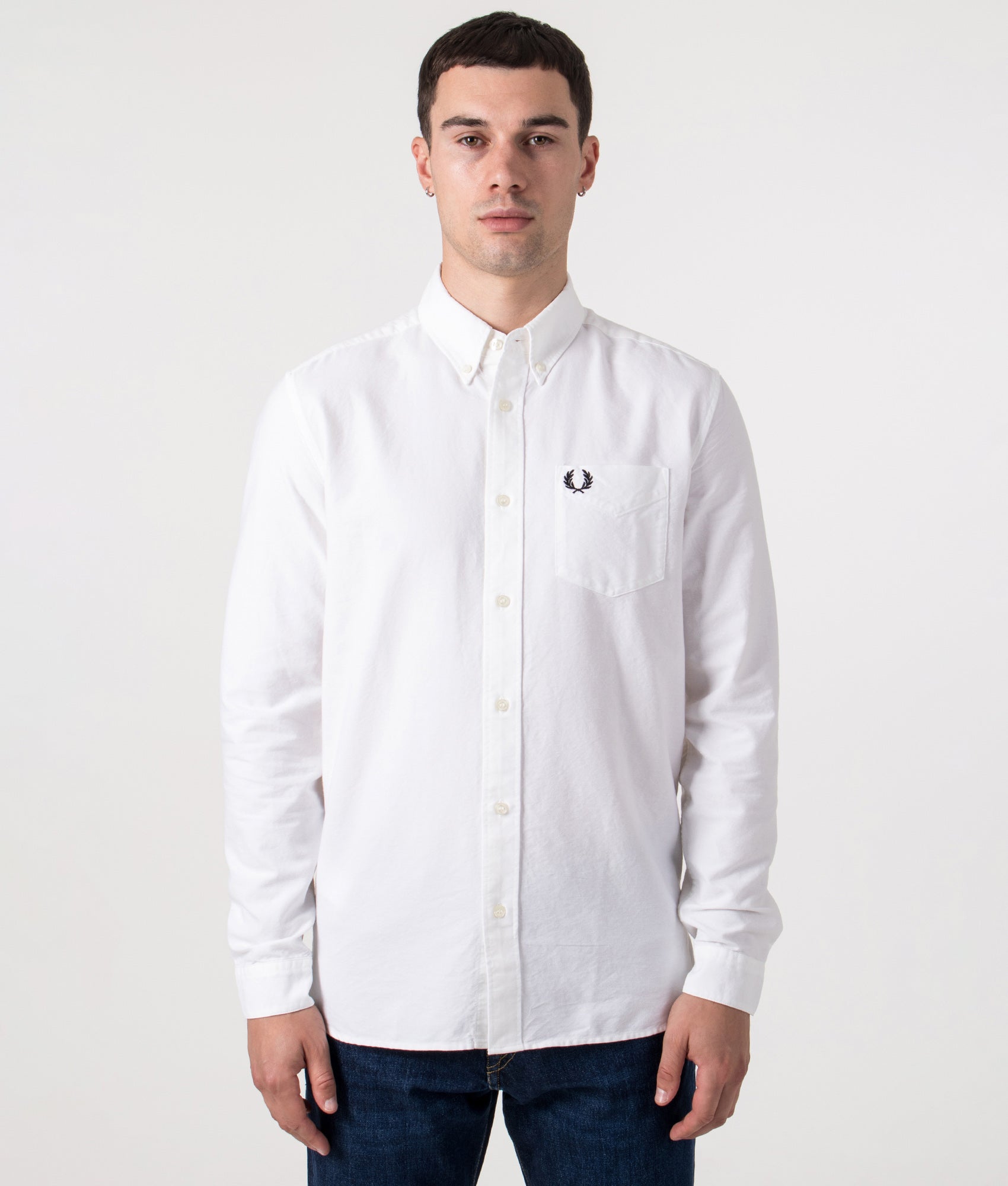 Fred Perry Oxford Shirt in White at EQVVS Menswear. Model front shot.
