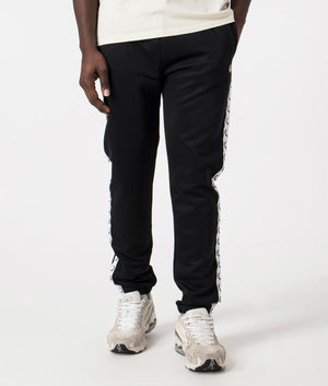 Track Pants in Black by Fred Perry. EQVVS Front Angle Shot.