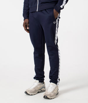 Track Pants in Carbon Blue by Fred Perry. EQVVS Side Angle Shot.