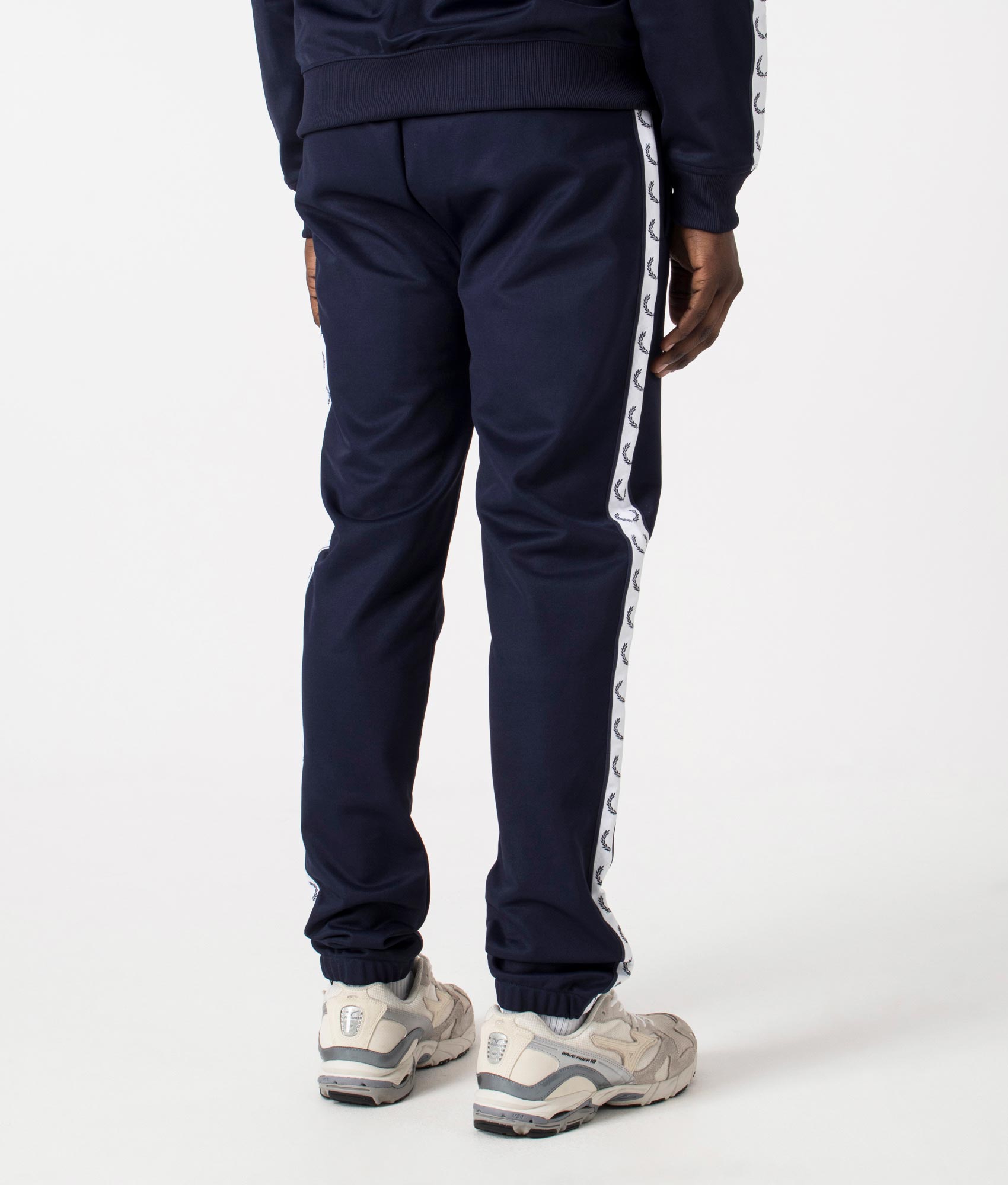 Track Pants in Carbon Blue by Fred Perry. EQVVS Back Angle Shot.