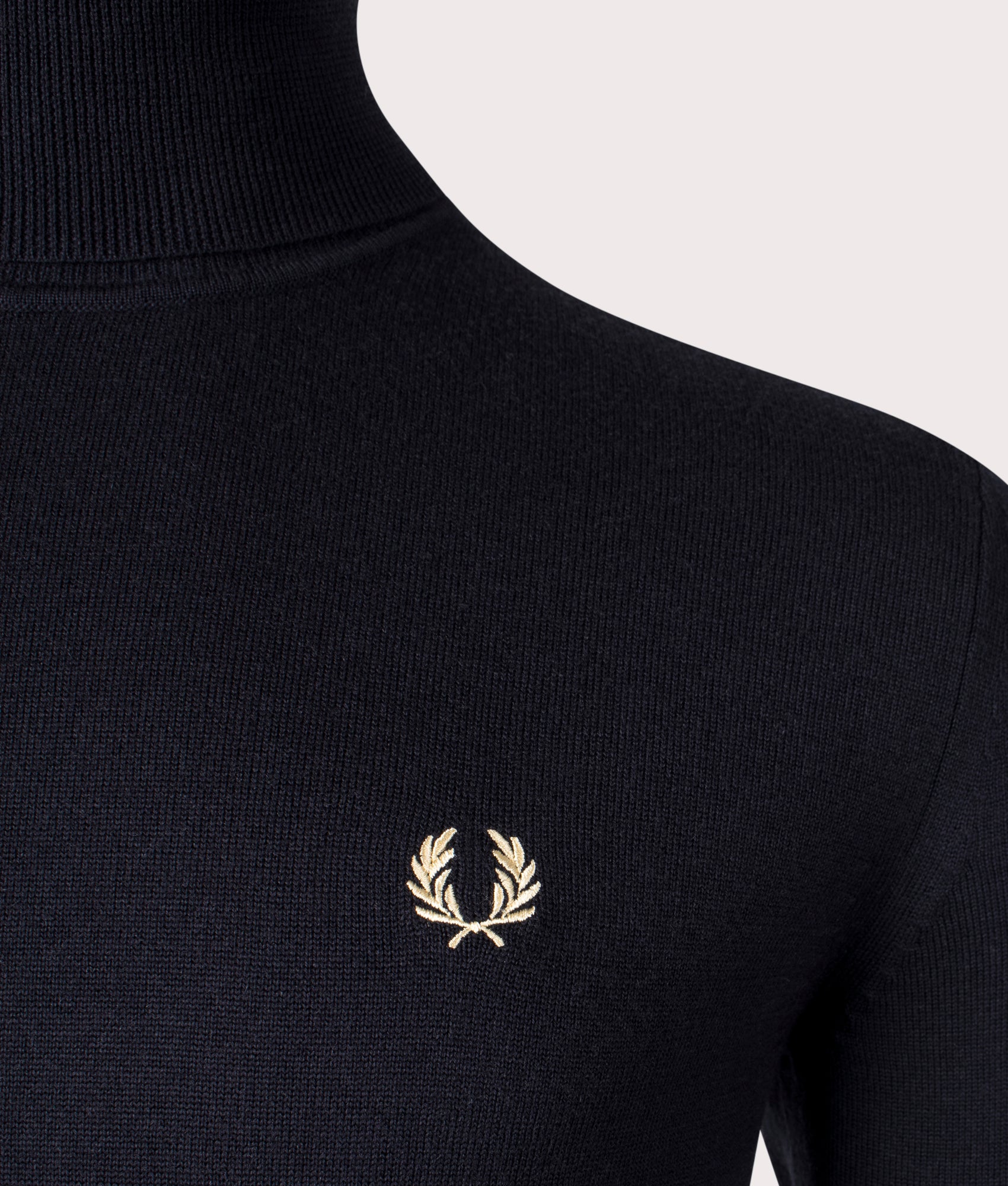 Fred Perry Roll Neck Jumper in Black at EQVVS Menswear. Detail shot.