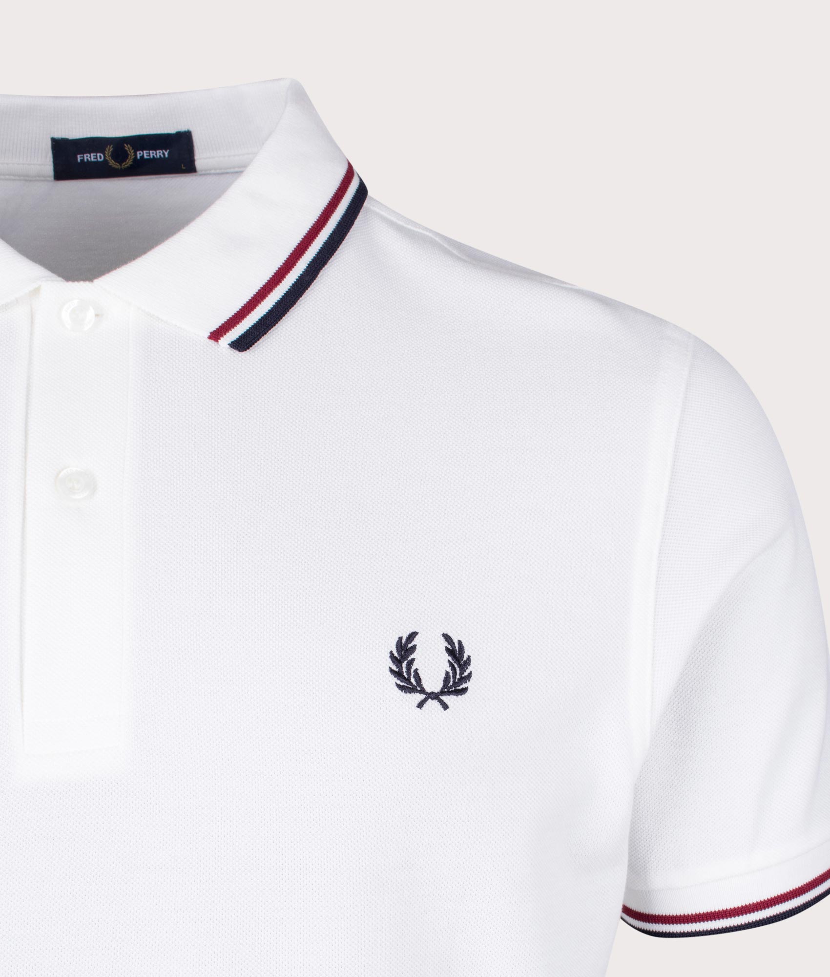 Fred Perry Twin Tipped Fred Perry Polo Shirt in White, Brick Red and Navy at EQVVS Menswear. Detail shot.