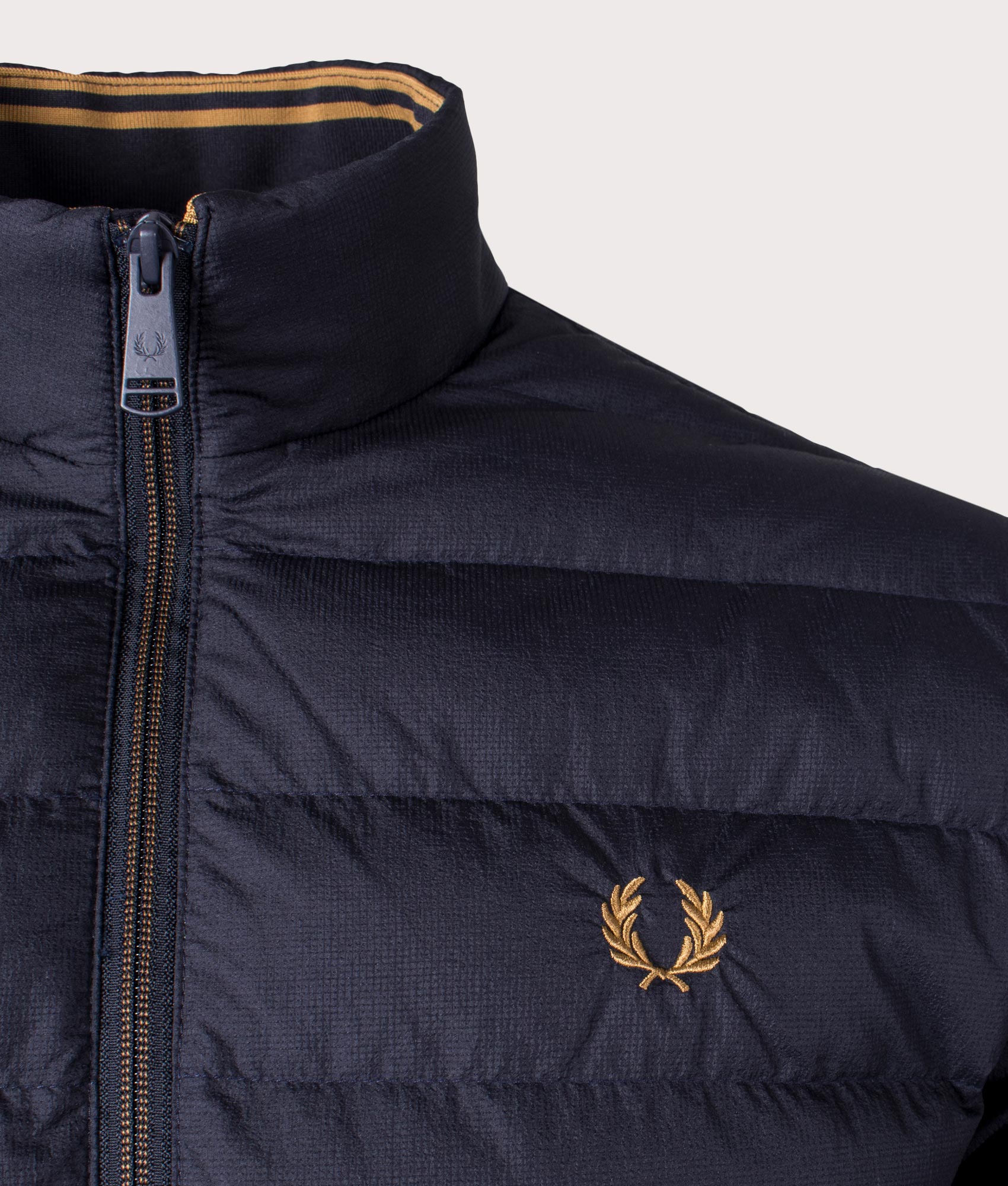 Fred Perry Insulated Jacket in Navy at EQVVS Menswear. Detail shot.