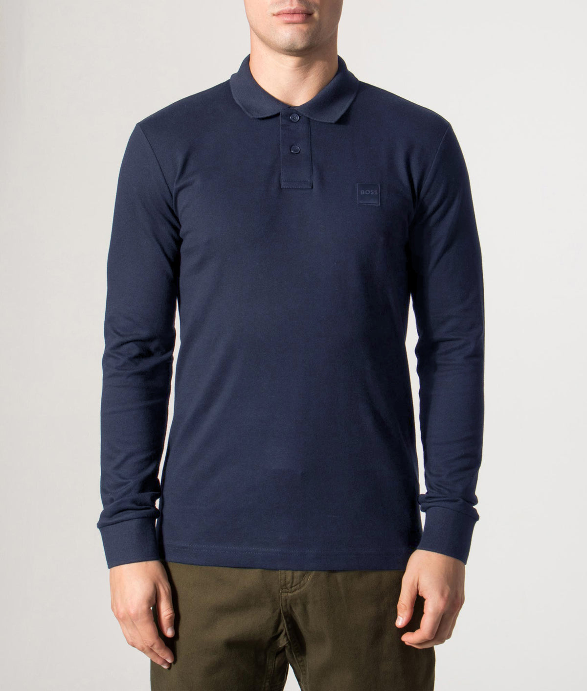 Boss Slim Fit Passerby long sleeve Polo Shirt in Dark Blue at EQVVS Menswear. Front model shot.